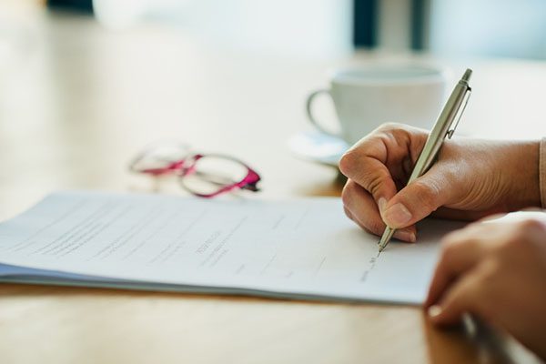 Close up of form being filled out with a pen